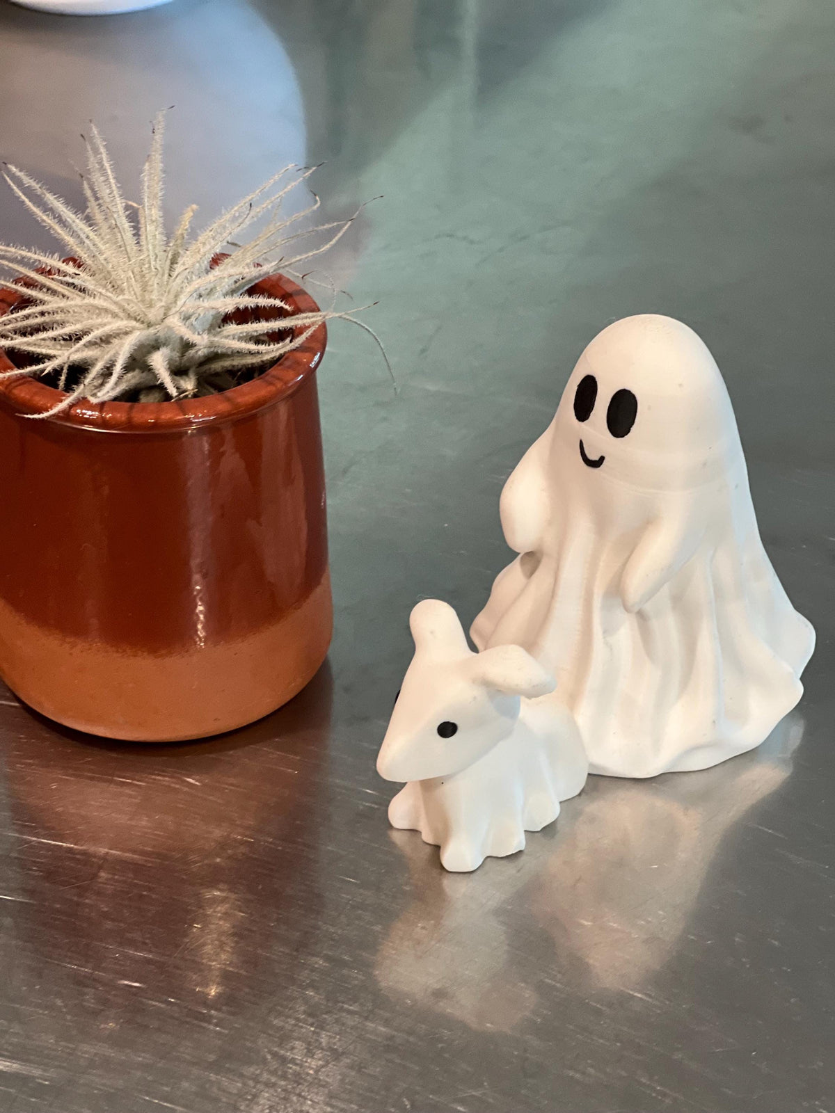 This is a cute little ghost and his dog, Halloween decor for any setting