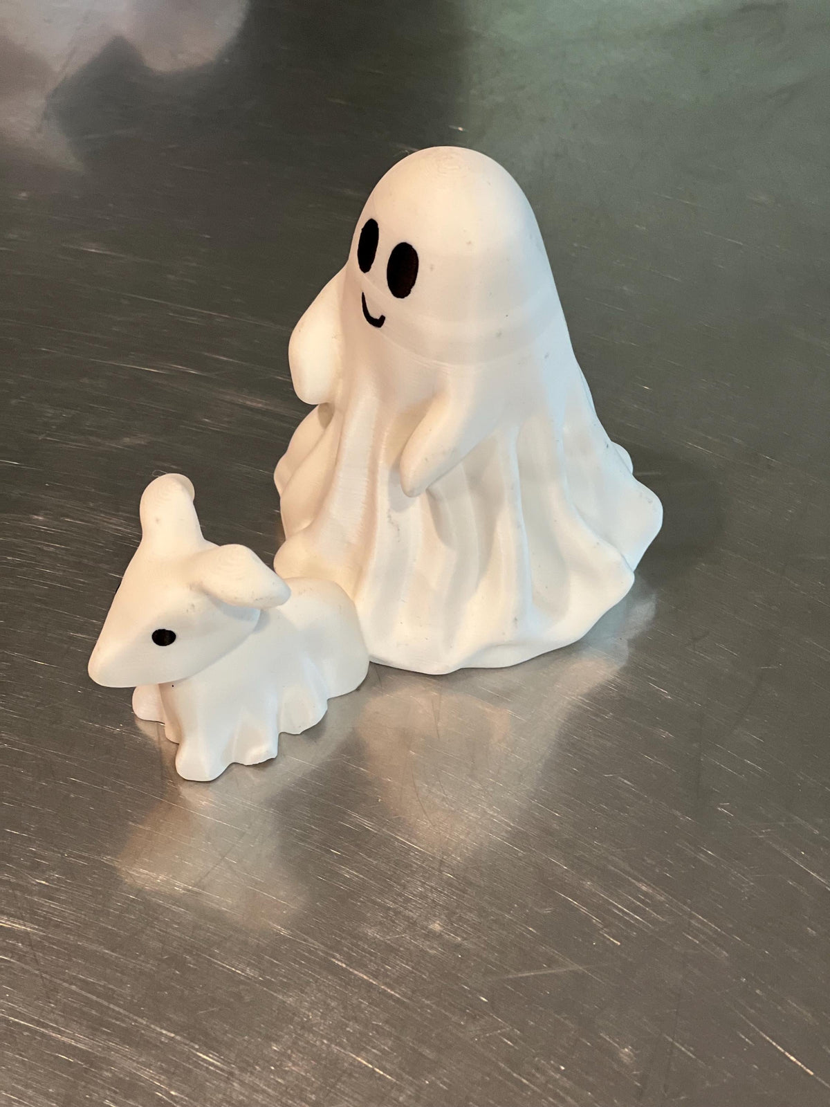 This is a cute little ghost and his dog, Halloween decor for any setting