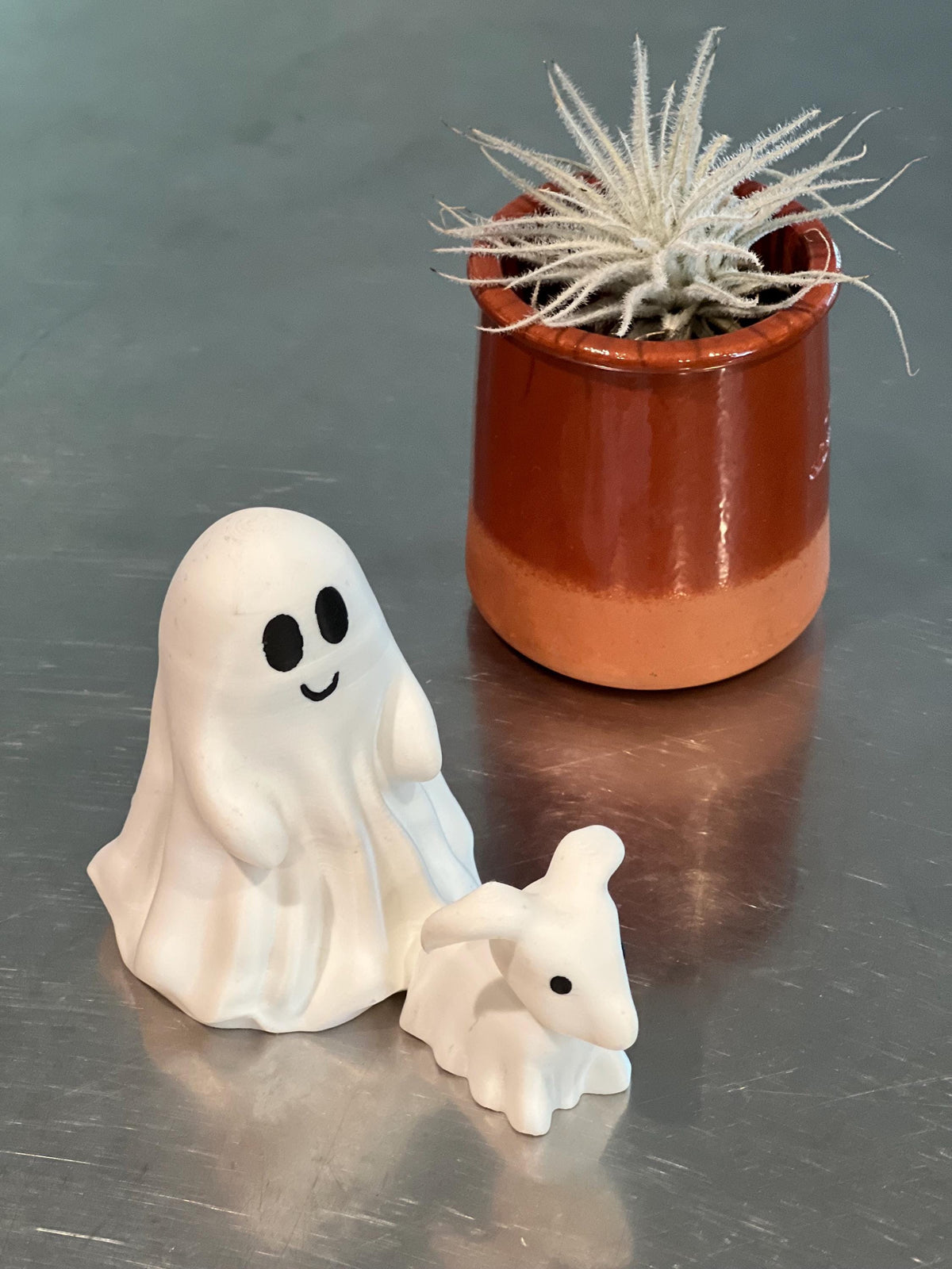 This is a cute little ghost and his dog, Halloween decor for any setting