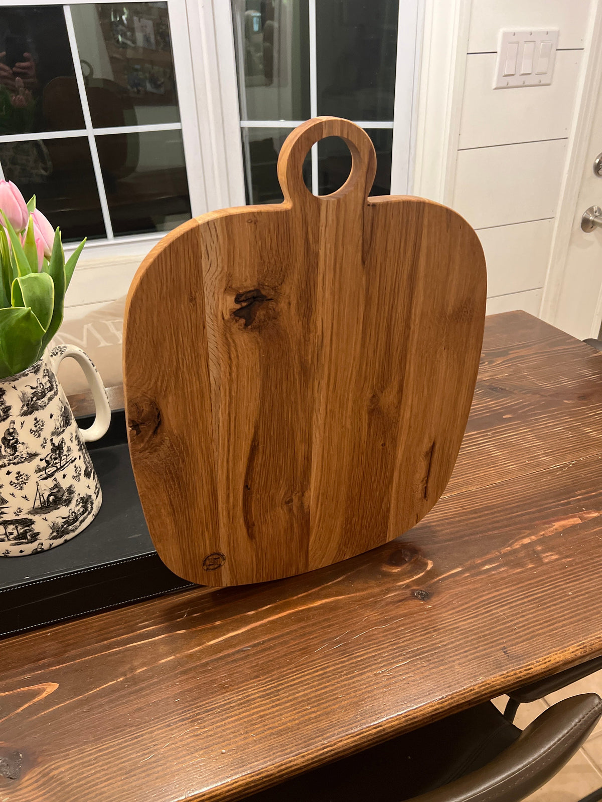 This is a 14” x 18” organic, circular handle, Maple cutting board/Homeware