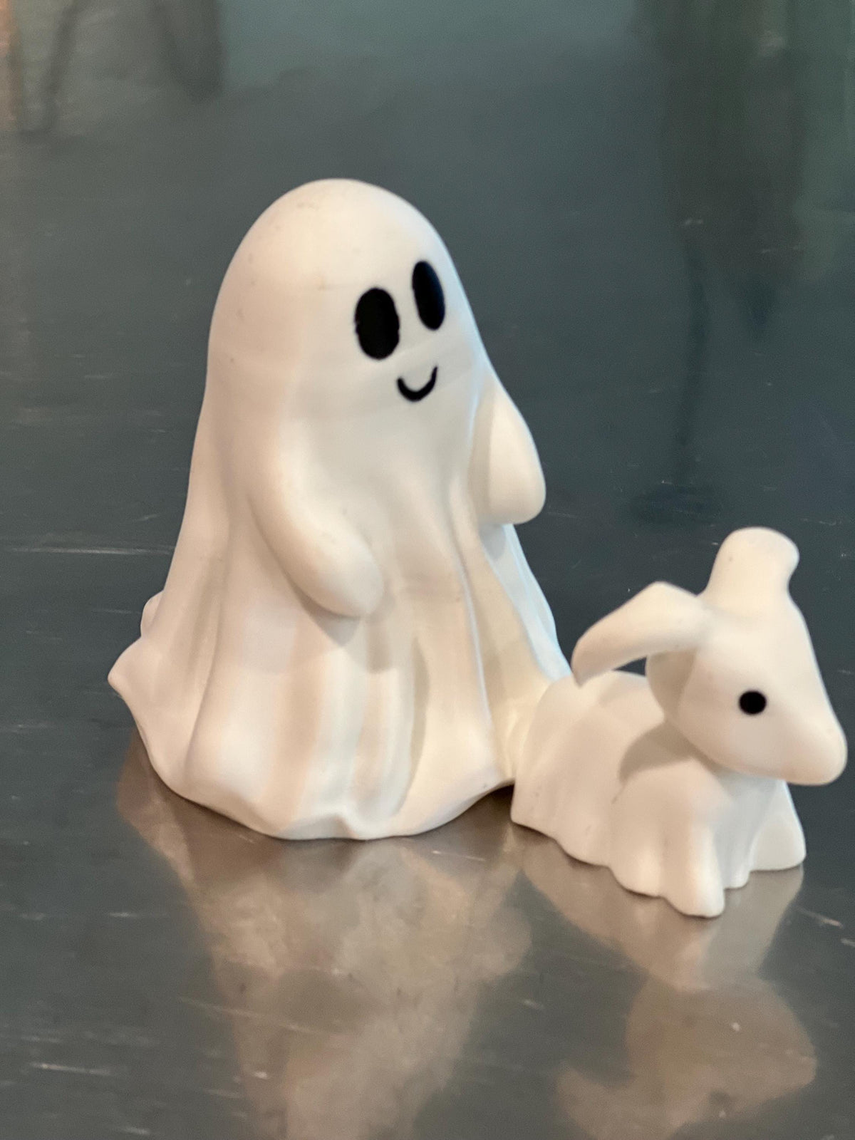This is a cute little ghost and his dog, Halloween decor for any setting