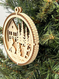 This is a round wooden Christmas ornament with a winter scene with a living hinge. It shows the kids having fun playing in the snow.