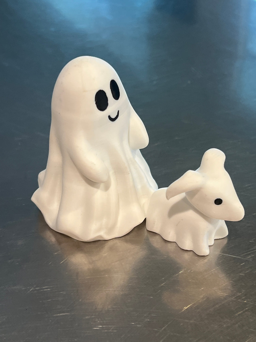 This is a cute little ghost and his dog, great home decor for the Halloween season