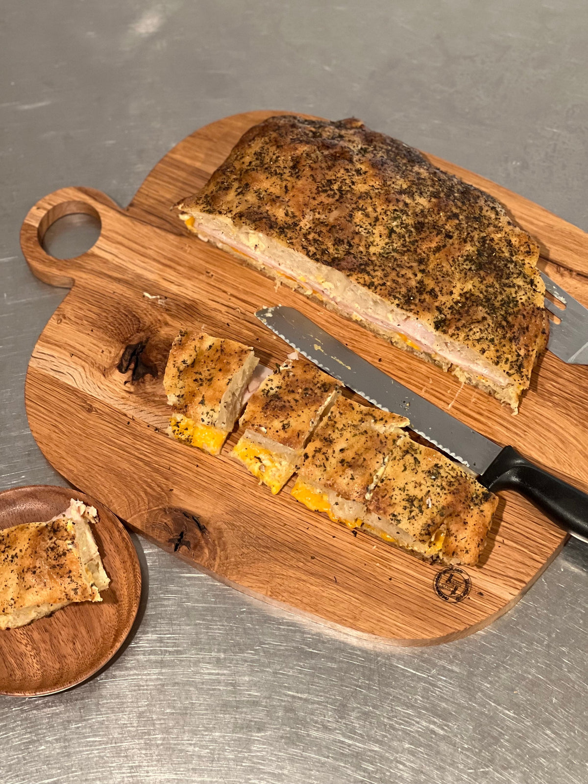 This is a 14” x 18” organic, circular handle, Maple cutting board/Homeware
