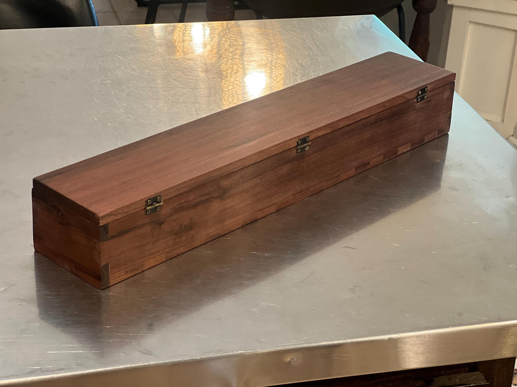 This is a black walnut custom-made carrying case / handmade