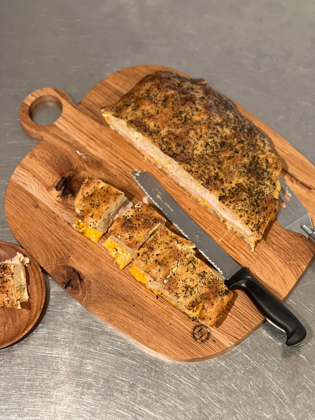This is a 14” x 18” organic, circular handle, Maple cutting board/Homeware