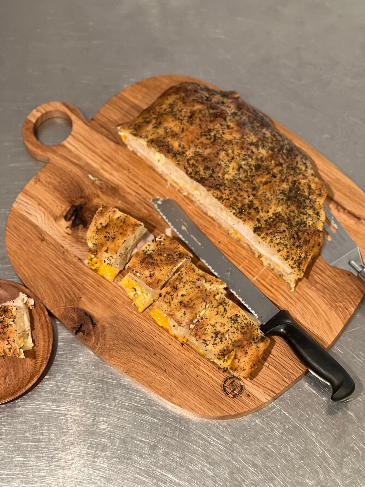 This is a 14” x 18” organic, circular handle, Maple cutting board/Homeware