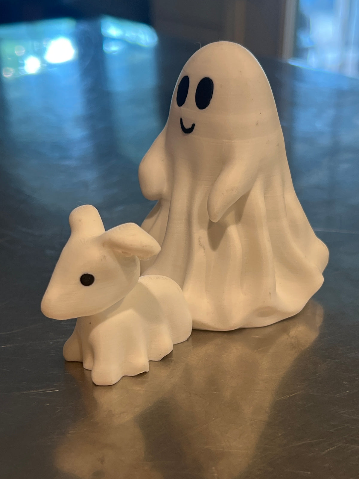 This is a cute little ghost and his dog, great home decor for the Halloween season