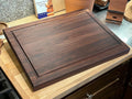 Edge grain Walnut cutting board with juice grove